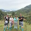 Lux Travel DMC product team surveying remote mountain trails and weather conditions during trekking in Northern Vietnam
