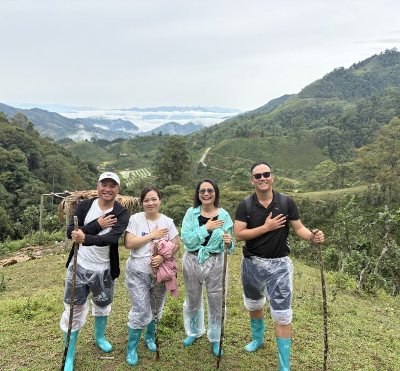 Lux Travel DMC product team surveying remote mountain trails and weather conditions during trekking in Northern Vietnam